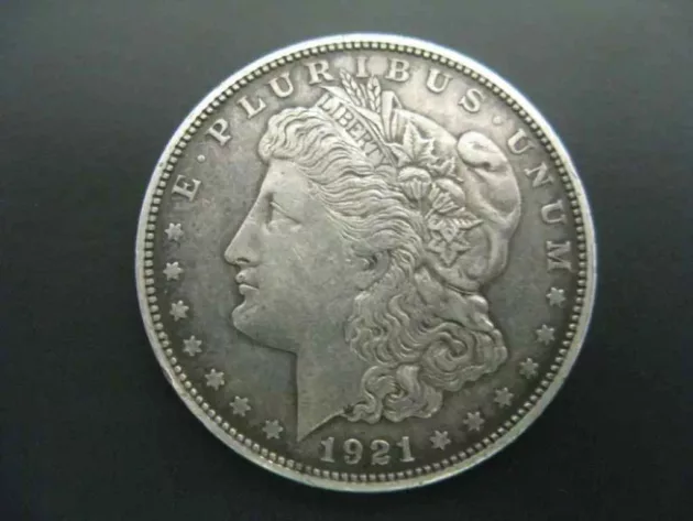 This is a 1921 Morgan silver dollar. 