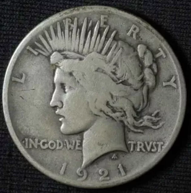 Even though both are silver dollars, a 1921 Peace dollar (pictured here) is worth more than a 1921 Morgan dollar. That's largely because there are many more 1921 Morgan dollars than 1921 Peace dollars known to exist.