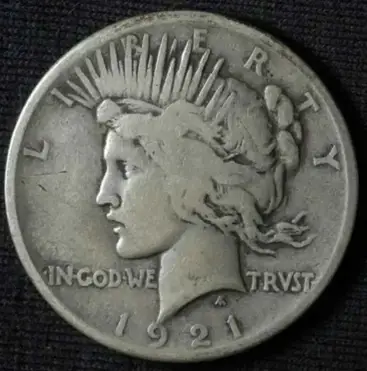 This is a 1921 Peace silver dollar.