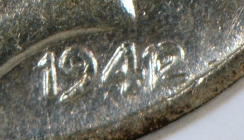 Closeup of a rare 1942/1 Mercury dime.