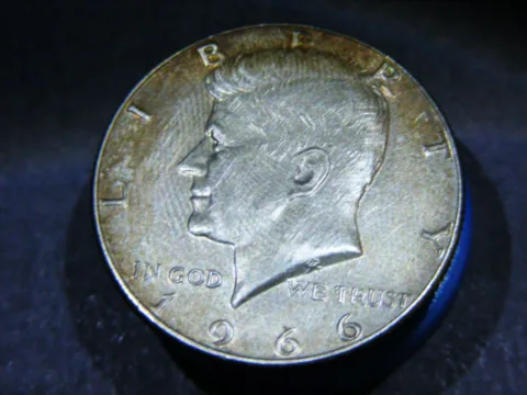 A 1966 Kennedy half dollar with no mintmark. 