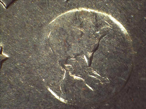 1972-Eisenhower-Dollar-Type-2 An example of a Type II Eisenhower dollar coin. If you look at the image of the Earth on the reverse, you'll notice the flatter, nearly indistinguishable islands south of Florida. Also, Florida itself is pointier than it appears on the Type I and Type II varieties.