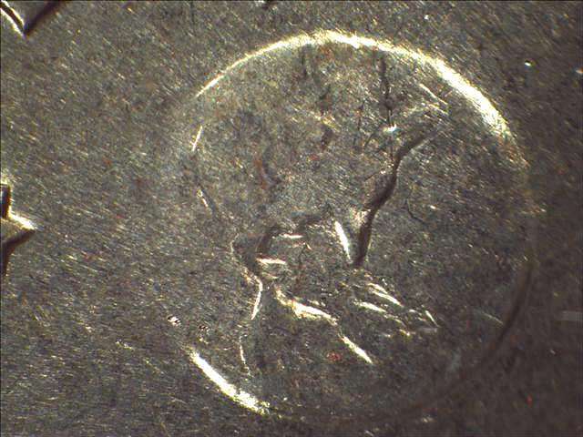 An example of a Type II Eisenhower dollar coin. If you look at the image of the Earth on the reverse, you'll notice the flatter, nearly indistinguishable islands south of Florida. Also, Florida itself is pointier than it appears on the Type I and Type II varieties. photo is public domain. An example of a Type II Eisenhower dollar coin. If you look at the image of the Earth on the reverse, you'll notice the flatter, nearly indistinguishable islands south of Florida. Also, Florida itself is pointier than it appears on the Type I and Type II varieties.