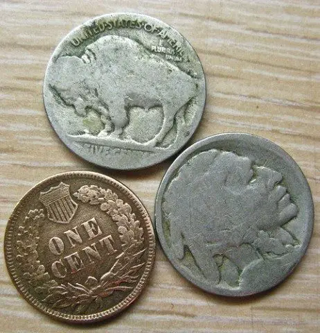 Here you can see the front and back of dateless Buffalo nickels (aka Indian Head nickels), next to an old penny.