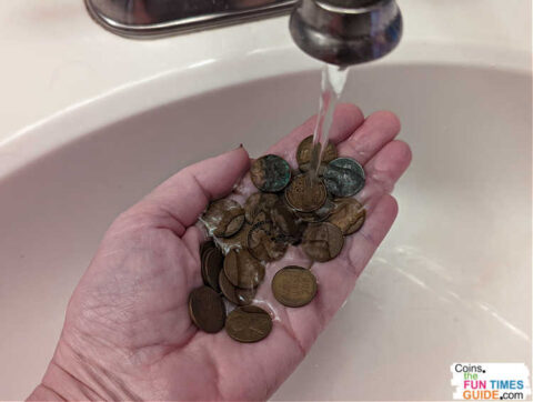 clean-coin This is the safest way to clean coins... simply hold them under a stream of water to remove debris. Then, pat each coin dry, one by one.