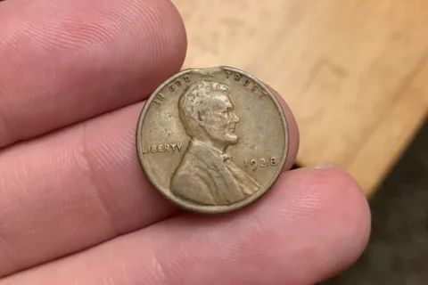 A clipped planchet penny. One cent planchet error coin