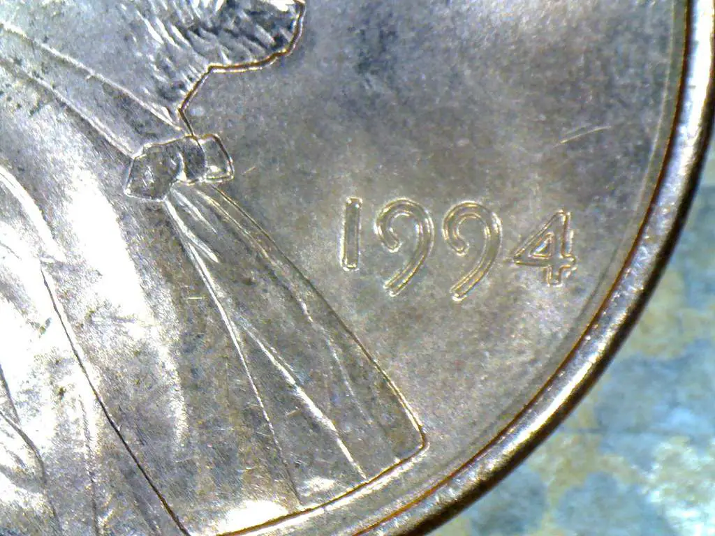 Variety coins have oddities that were caused by a specific die at the U.S. Mint -- these may have been replicated thousands of times before the faulty die was removed from service. 