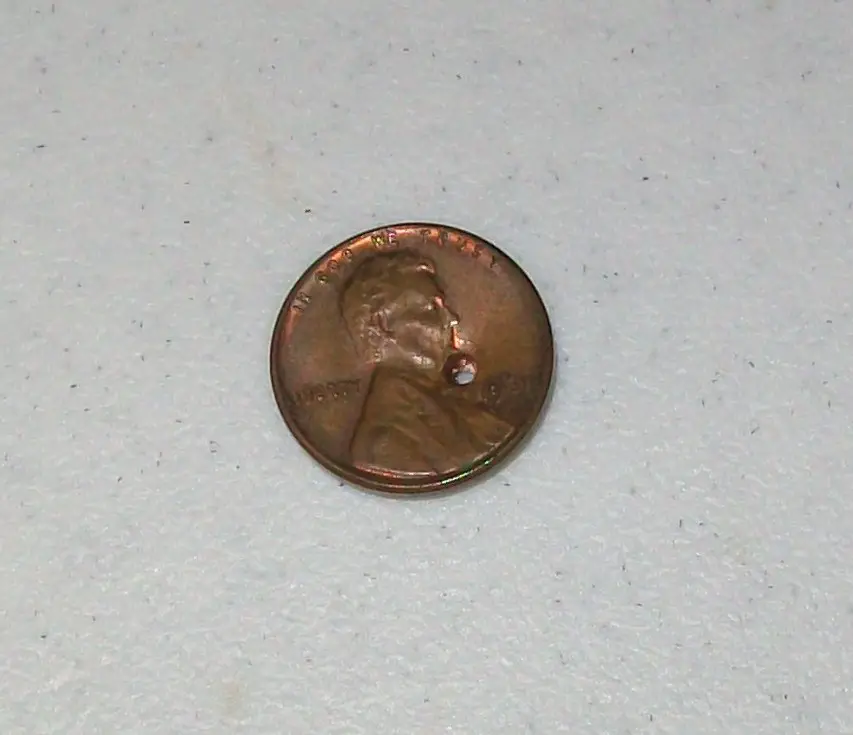 This 1961 penny has a very distracting, obvious hole right in front of Lincoln's chin.