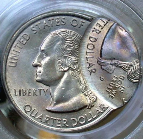 This is an example of a 1999-P New Jersey state quarter with an off-center error.
