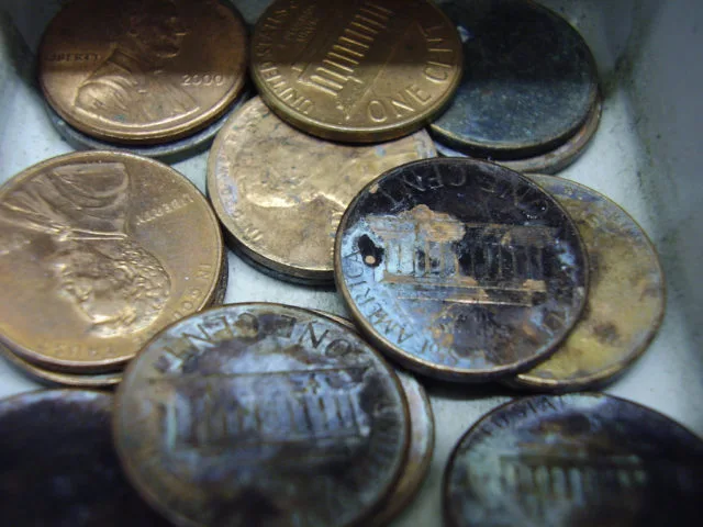 Here are a bunch of old, dirty, and damaged coins. See how to properly clean old coins.