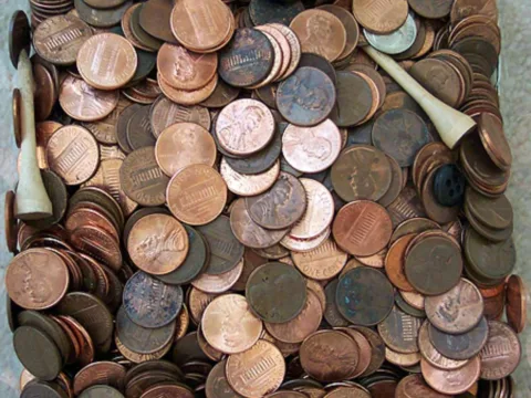 A glance inside my spare change jar as it looks today with all of the valuable coins removed. It's just a bunch of pennies, a few buttons, and a couple golf tees now. Someday I need to put all of those pennies into coin rolls!