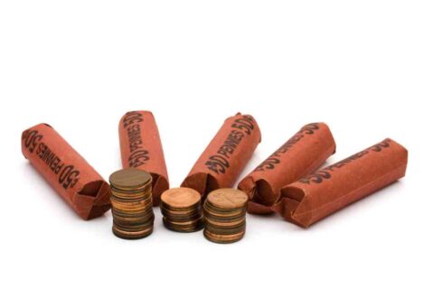 Stacks of U.S. pennies and penny wrappers. Stacks of U.S. pennies and penny wrappers.