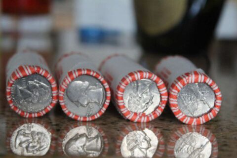 Quarter coin rolls - bank rolls of quarters cost $10 apiece and contain 40 coins