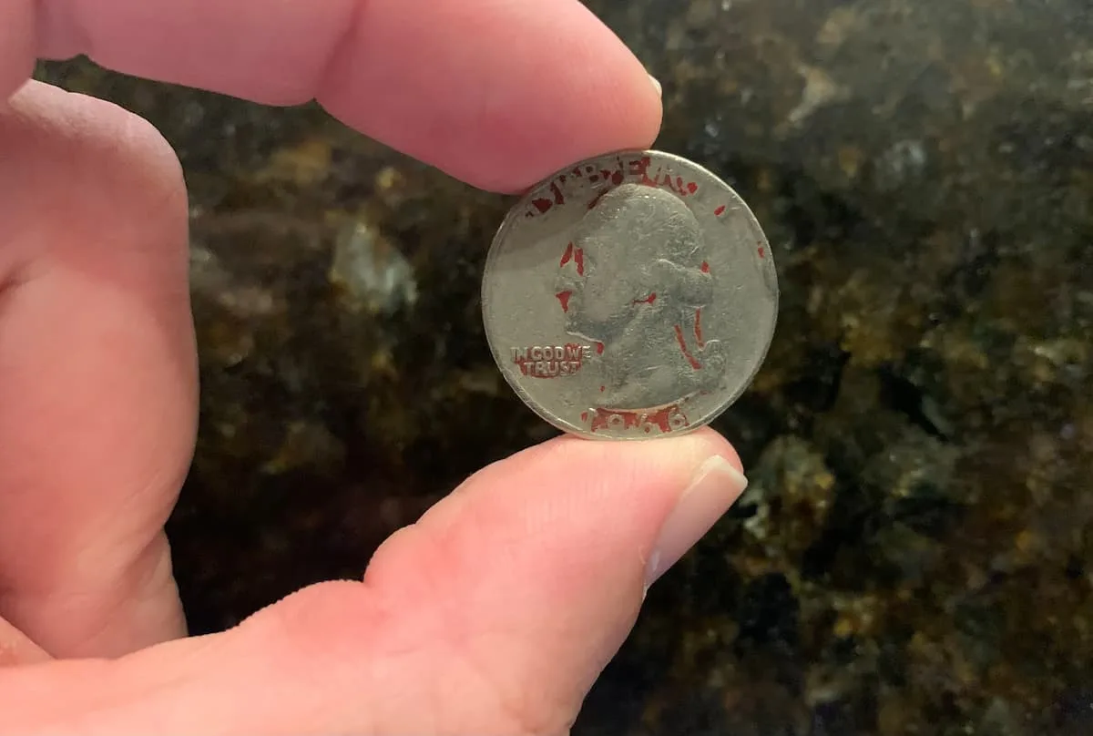 The mystery behind the red quarter has been solved! Here's what red painted quarters mean and how much they're worth today.