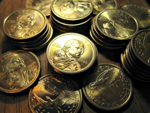 Stacks of Sacagawea dollar coins. 