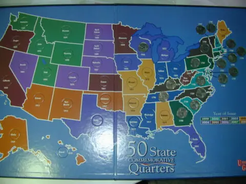 A state quarters collection saved on a 50 State Quarters map board