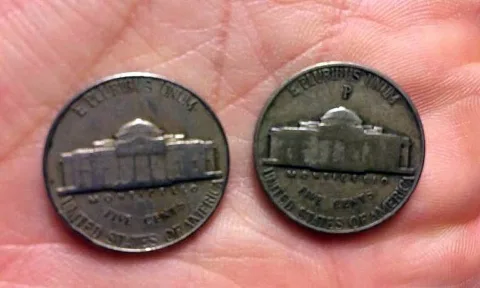 Pictured on the left is a regular Jefferson nickel. On the right is a silver nickel. Notice the large "P" mintmark over Monticello on the silver wartime nickel? 